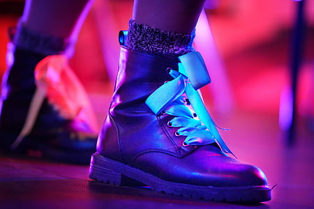 person wearing black leather work boot thumbnail