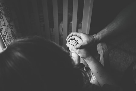 greyscale photo of family holding each other hand thumbnail