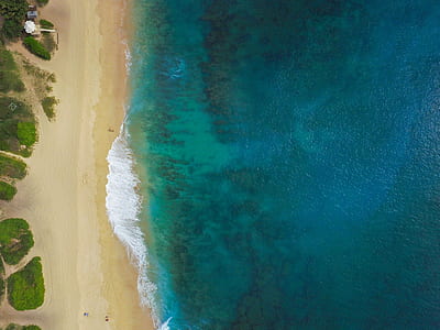 aerial photography of large body of water and shoreline thumbnail