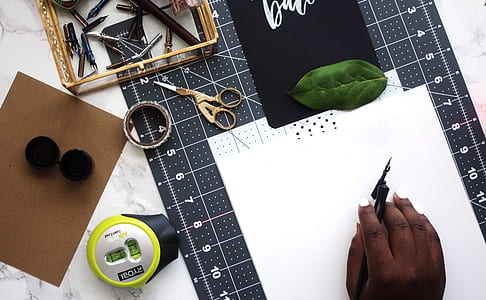 person holding black pen thumbnail