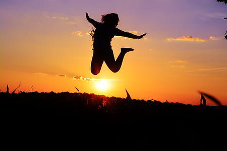 woman taking jump shot under golden house thumbnail