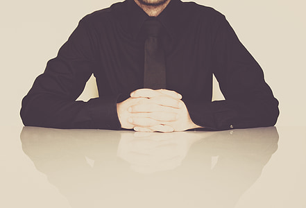 man in black dress shirt and white gloves thumbnail