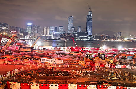Night View Of Under Construction Building Site With Cranes In Hong Kong thumbnail