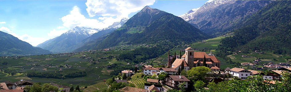 bird's-eye view photography of houses near mountain thumbnail