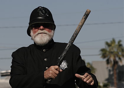 man holding baton thumbnail
