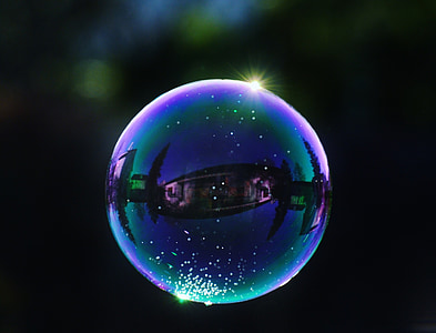 selective focus photography of bubbles at night time thumbnail