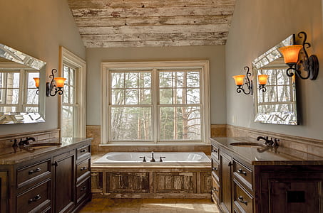 interior of bathroom with lighted sconces thumbnail