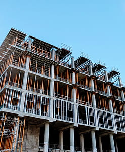gray and brown building under cloudy sky during daytime thumbnail