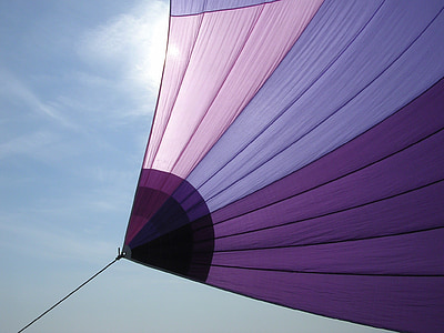 purple, pink, and lavender textile under blue sky thumbnail