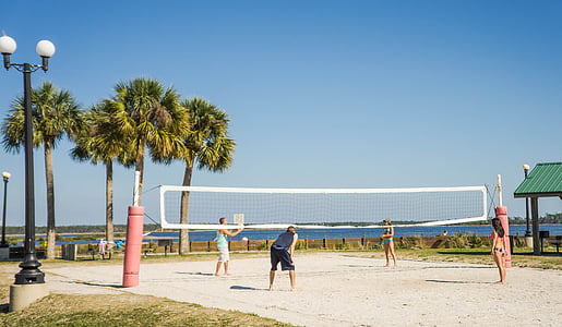man and woman playing on sand thumbnail