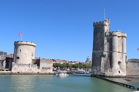 white boat near beige castle at daytime thumbnail