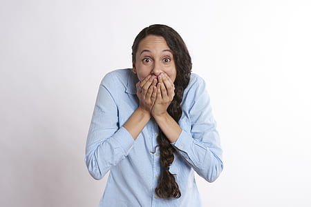woman covering her mouth thumbnail