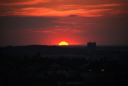 silhouette of buildings during sunset thumbnail