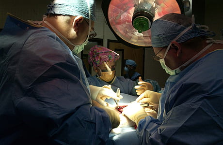 doctors operating inside operating room thumbnail