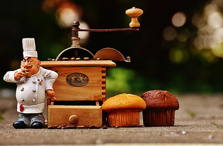 two brown and chocolate cupcakes near music box thumbnail