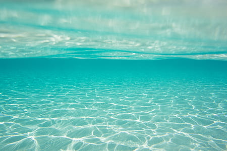 body of water below white clouds thumbnail