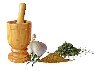 brown wooden mortar and pestle and several spices thumbnail