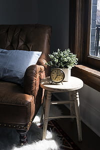 gray metal alarm clock on wooden stool at 2:35 thumbnail
