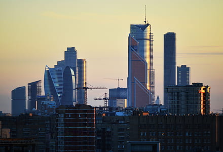 photo of high-rise buildings with tower cranes thumbnail