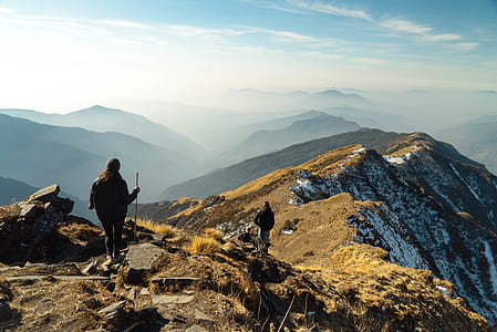 two person walking on peak of mountain thumbnail