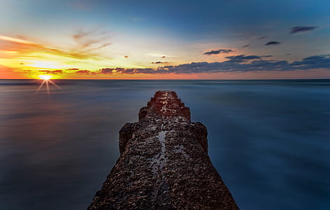 photo of brown concrete dock during golden hour thumbnail