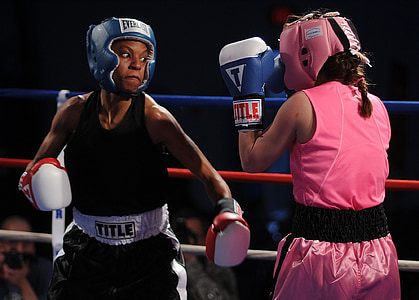 woman wearing black Title tops punching a woman wearing pink gear set thumbnail
