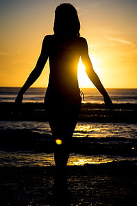 woman's silhouette in beach thumbnail