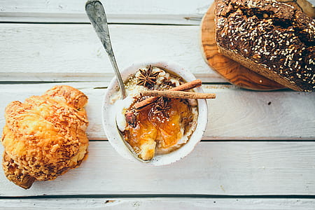 Three Assorted Dressed Foods on White Wooden Surface thumbnail