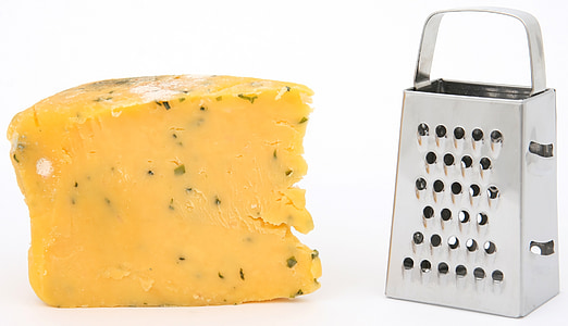 cheese beside silver cheese shredder thumbnail