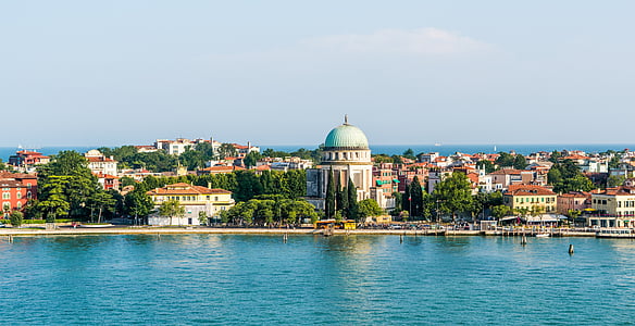 high-rise buildings near body of water thumbnail