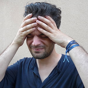 man doing holding head thumbnail