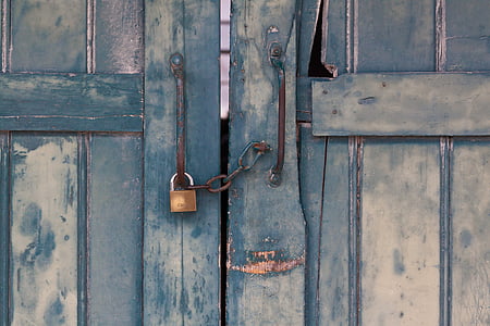 blue wooden door with brass-colored padlock thumbnail