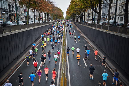 people running during daytime thumbnail