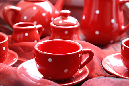 selective focus photography of red-and-white polka-dot ceramic teacup on saucer thumbnail