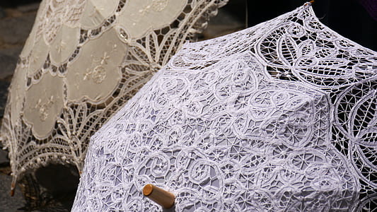 two white and beige lace umbrellas opened thumbnail