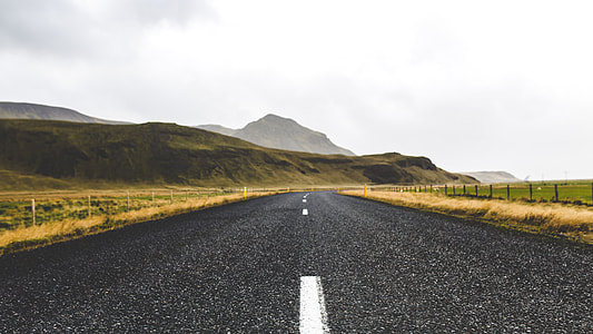landscape photography of gray asphalt road thumbnail