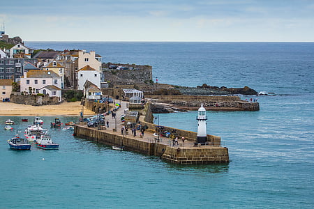 white lighthouse on dockside thumbnail