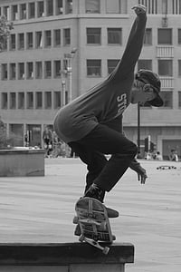 grayscale photography of boy skate boarding thumbnail