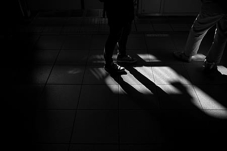 grayscale photo of two person standing in room thumbnail