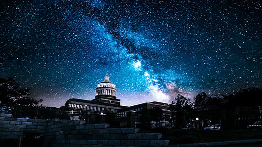 white building under blue sky during nighttime thumbnail