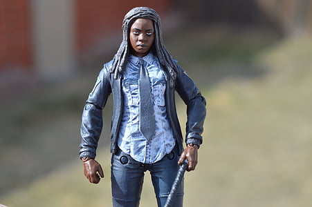 selective focus photography of person in gray jacket action figure thumbnail