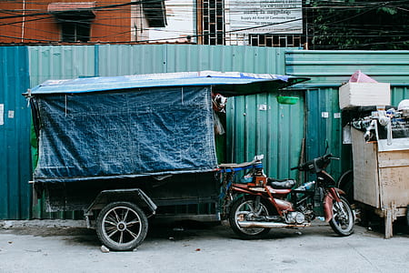red automatic motor scooter next to food cart thumbnail