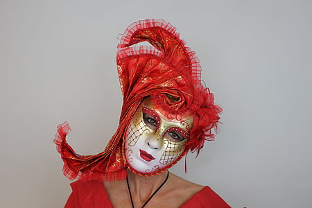 person wearing red and white masquerade mask thumbnail