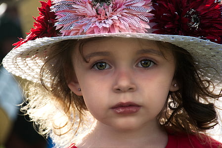 girl wearing white flower accent sunhat thumbnail