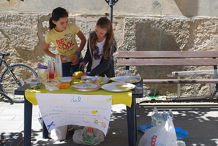 two girls near table during daytime thumbnail