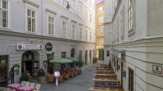 two green parasols near building thumbnail
