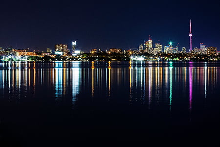 Canada high-rise buildings beside body of water at night time thumbnail