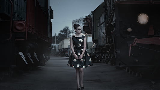 woman wearing black and white scoop-neck sleeveless mini dress thumbnail