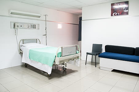 white hospital bed inside room thumbnail