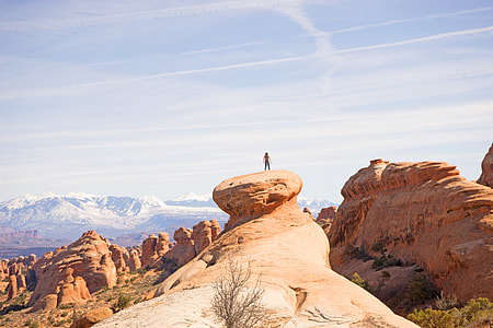 photo of person standing on rock thumbnail